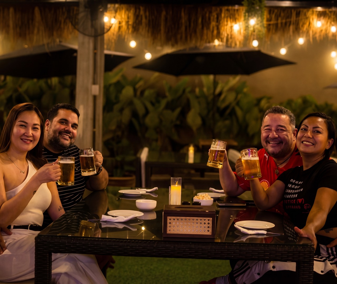 Guests toasting with beer in the garden