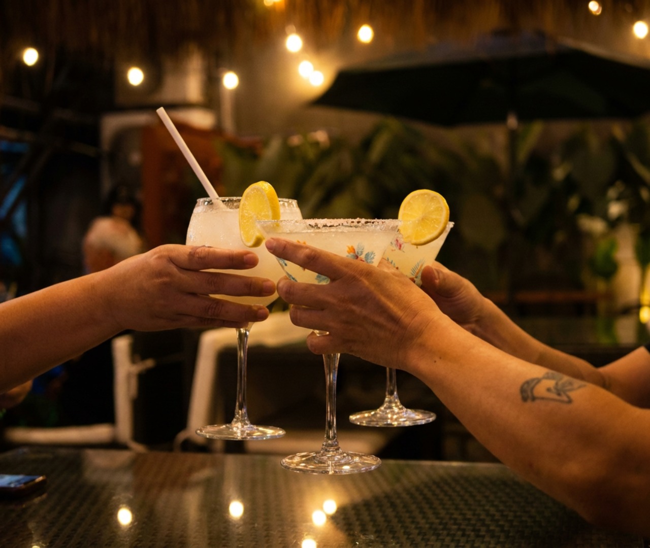 Margarita cheers at the bar